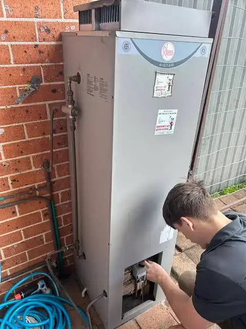 Hot water system repair in Kew
